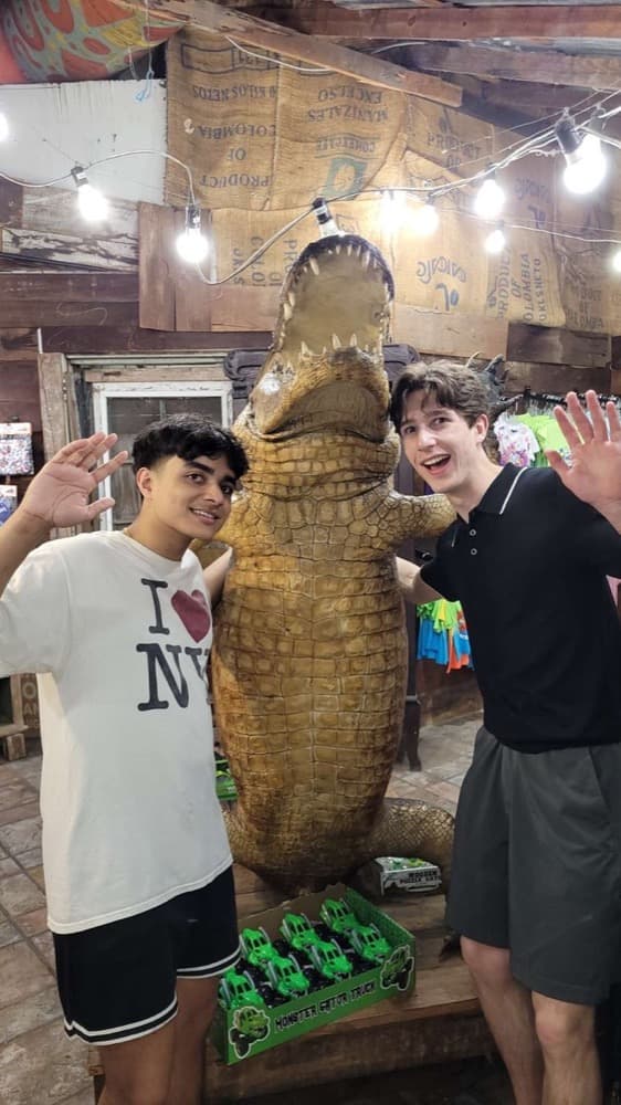 Two of us beside a stuffed alligator in a roadside shop